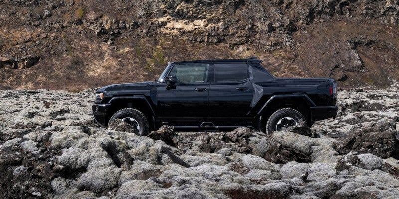 Gray Hummer ev in mountain road