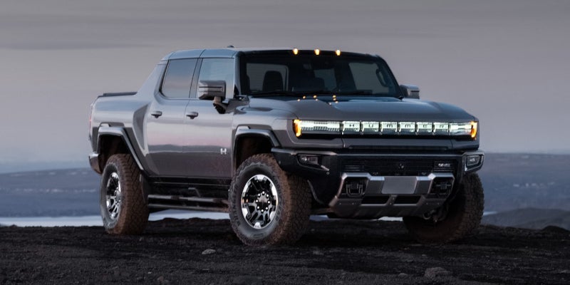 gray gmc running offroading
