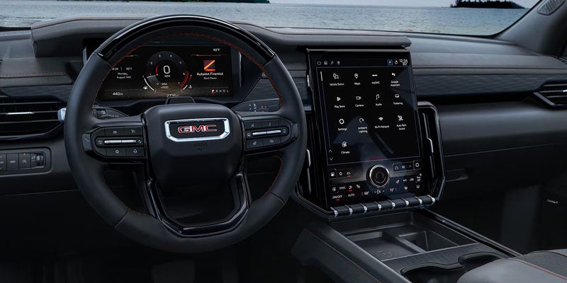 Driver cockpit of the 2026 GMC Acadia featuring advanced safety and driver assistance technology