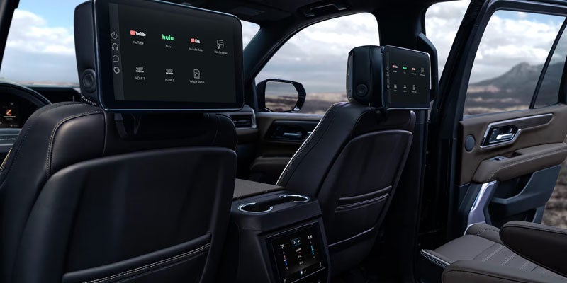Premium interior of the 2026 GMC Yukon featuring rear entertainment screens and spacious seating